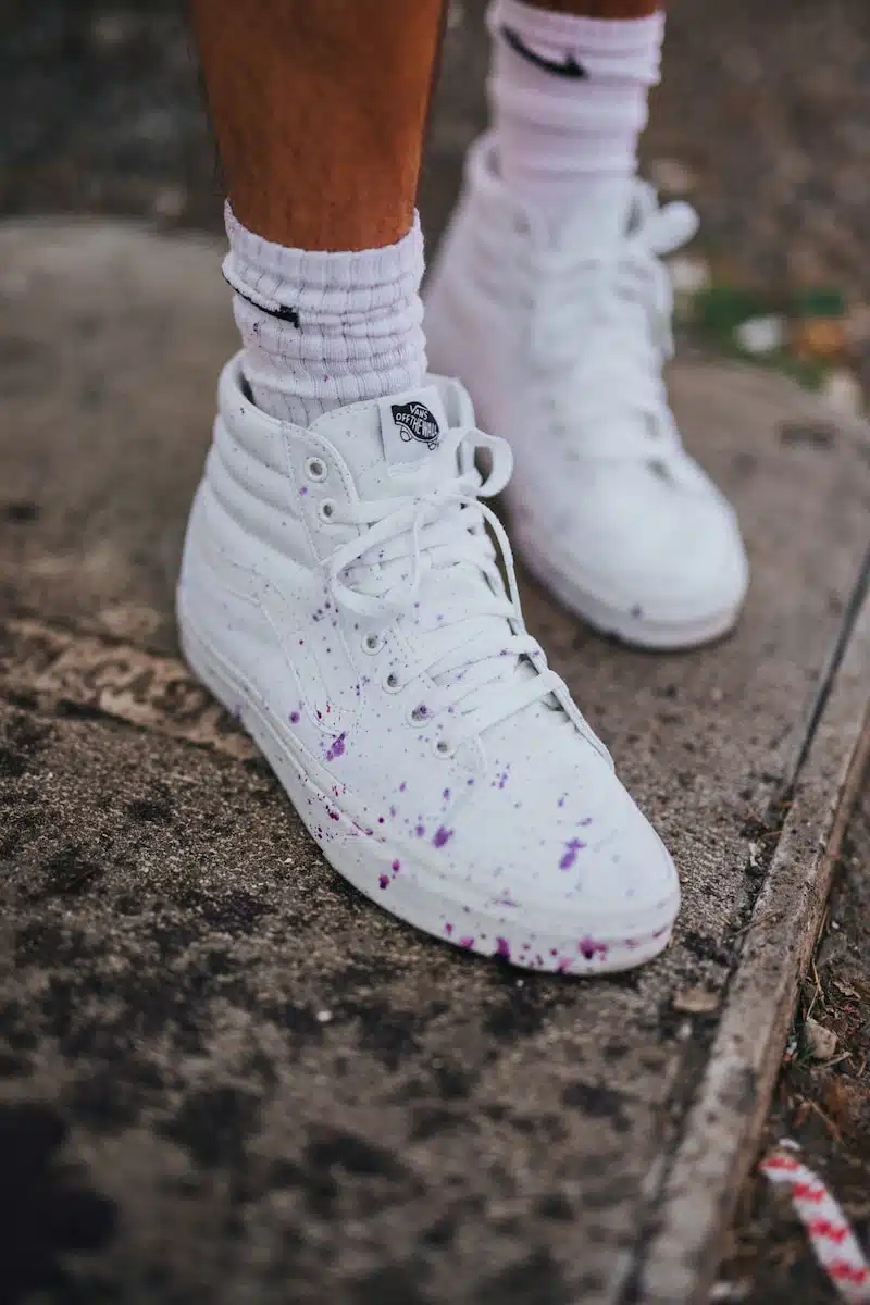 person wearing white nike air force 1 high