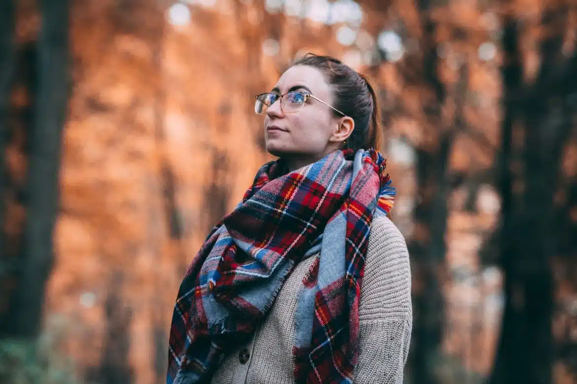 woman wearing red and black scarf